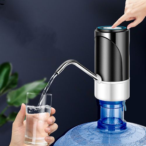 A person using the Electric Water Dispenser Pump With Touch Control to fill a glass with water.